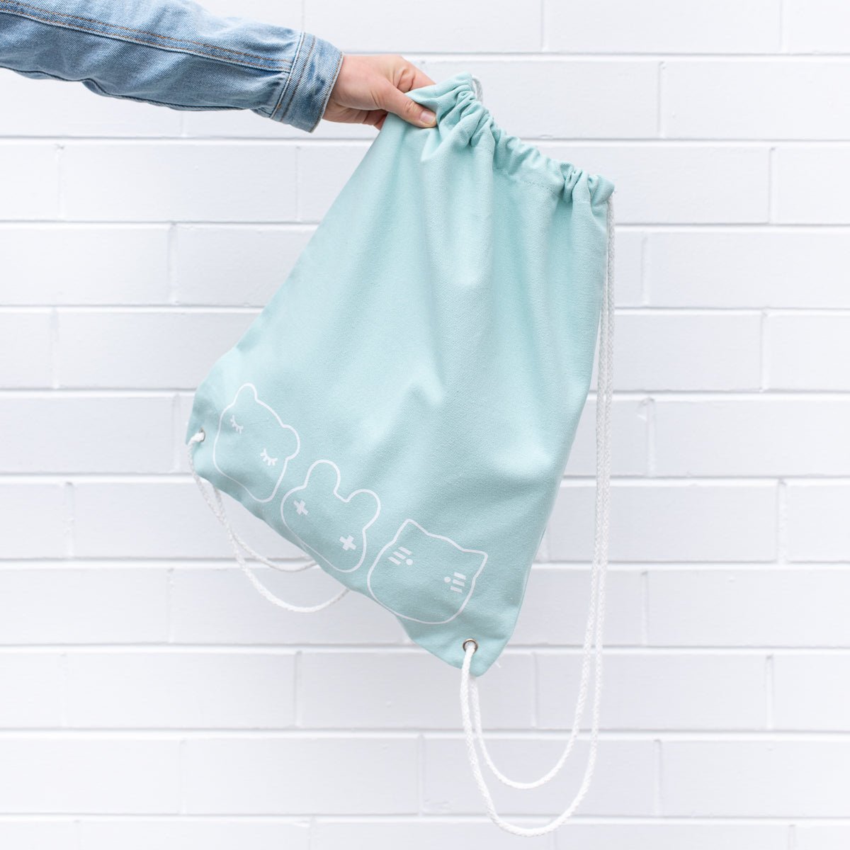 we-might-be-tiny-drawstring-canvas-bag-sage