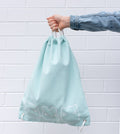 we-might-be-tiny-drawstring-canvas-bag-sage