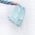 we-might-be-tiny-drawstring-canvas-bag-sage